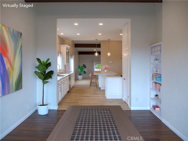 1446 Via Castilla, Palos Verdes Estates, CA 90274 - hallway featuring light wood-type flooring, baseboards, recessed lighting, built in shelves, and a sink