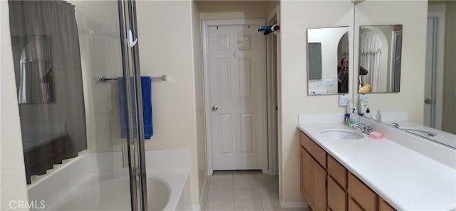 full bathroom with baseboards, walk in shower, a bath, vanity, and tile patterned flooring