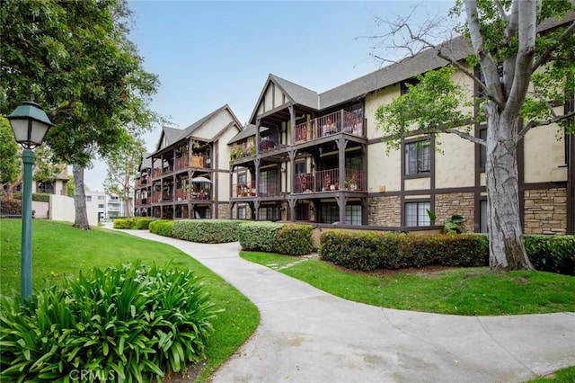 view of property's community with a yard