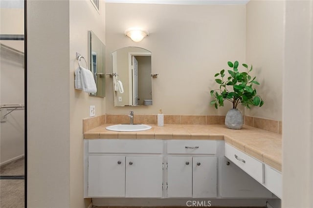 bathroom with visible vents and vanity