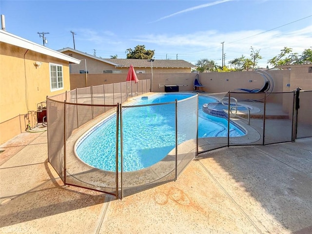 view of swimming pool featuring fence, a fenced in pool, and a patio area