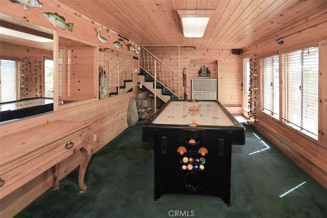game room featuring wooden ceiling, wooden walls, and carpet