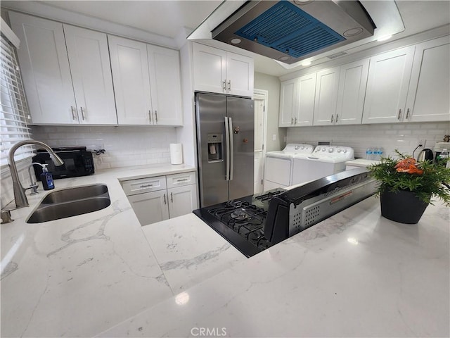 18214 Los Palacios Dr, Rowland Heights, CA 91748 - kitchen featuring stainless steel fridge, backsplash, a sink, and washing machine and clothes dryer
