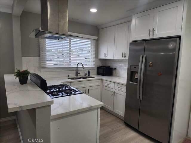 18214 Los Palacios Dr, Rowland Heights, CA 91748 - kitchen featuring stainless steel fridge, white cabinetry, island exhaust hood, a sink, and light wood finished floors