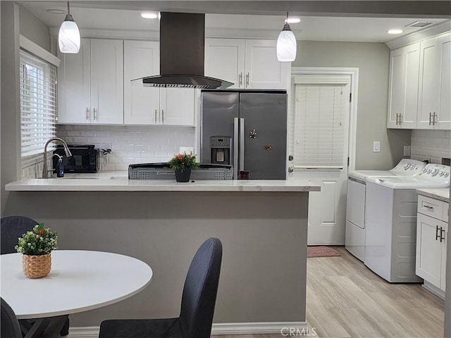 18214 Los Palacios Dr, Rowland Heights, CA 91748 - kitchen featuring a peninsula, range hood, white cabinetry, stainless steel fridge with ice dispenser, and independent washer and dryer