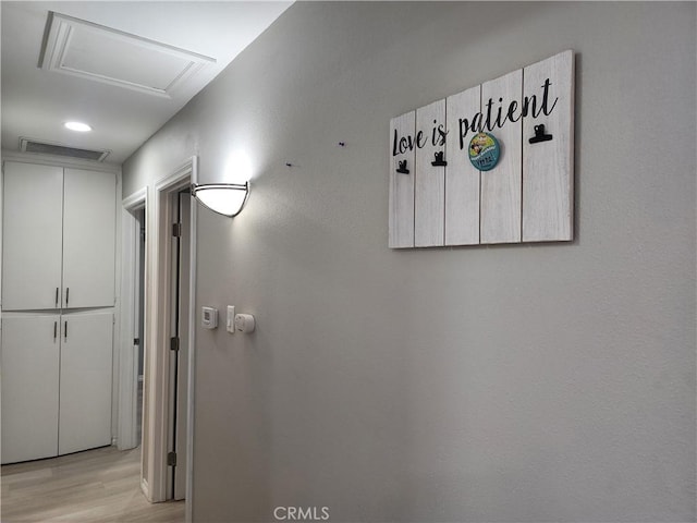 18214 Los Palacios Dr, Rowland Heights, CA 91748 - hallway featuring attic access, light wood-style flooring, and visible vents