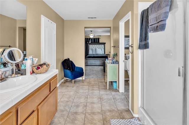 1781 Terrace Ave, Colton, CA 92324 - ensuite bathroom with ceiling fan, a stall shower, visible vents, baseboards, and ensuite bathroom
