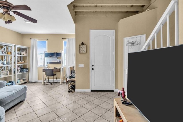 1781 Terrace Ave, Colton, CA 92324 - entrance foyer with baseboards, light tile patterned floors, ceiling fan, and stairs