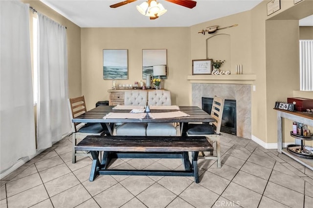 1781 Terrace Ave, Colton, CA 92324 - dining area with light tile patterned floors, ceiling fan, and a tiled fireplace