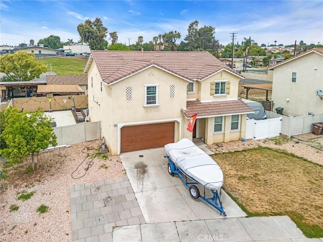 1781 Terrace Ave, Colton, CA 92324 - view of front facade with stucco siding, driveway, a tiled roof, and a garage