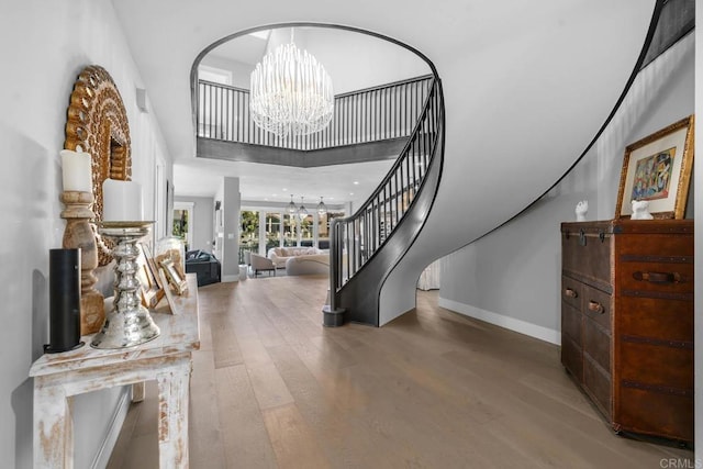 14 Buccaneer Way, Coronado, CA 92118 - entryway with a high ceiling, an inviting chandelier, stairs, baseboards, and wood finished floors