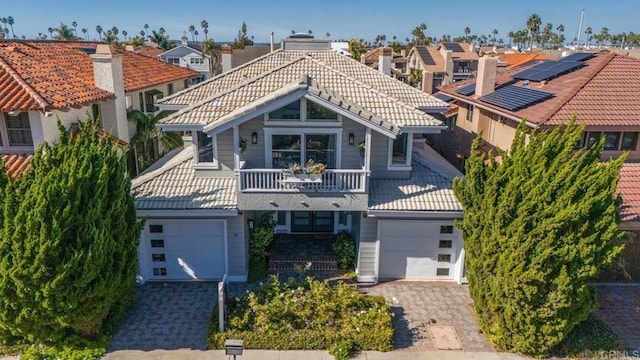 14 Buccaneer Way, Coronado, CA 92118 - view of front of home featuring decorative driveway, a balcony, a residential view, and a tile roof