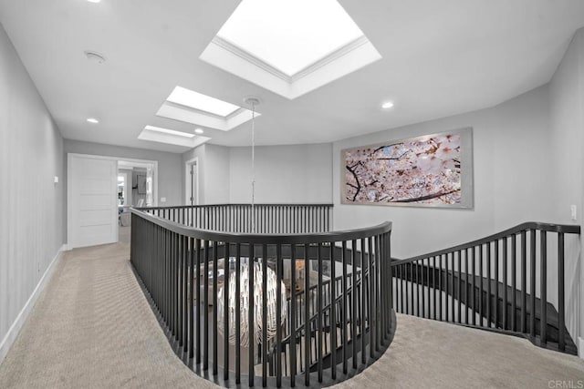 14 Buccaneer Way, Coronado, CA 92118 - hallway with recessed lighting, a skylight, carpet, an upstairs landing, and baseboards