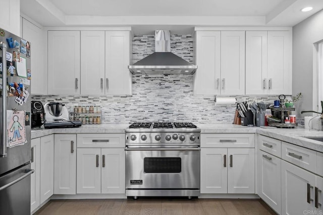 14 Buccaneer Way, Coronado, CA 92118 - kitchen with white cabinetry, tasteful backsplash, appliances with stainless steel finishes, and wall chimney range hood