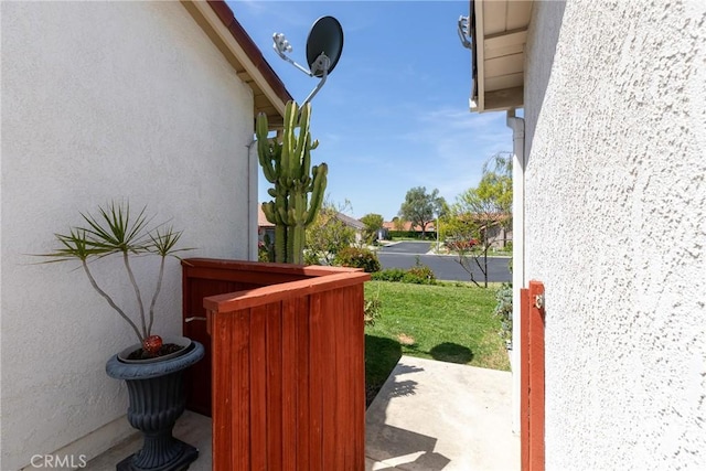 exterior space with stucco siding and a dry bar