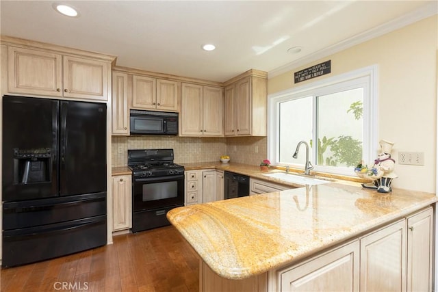 kitchen with decorative backsplash, a sink, light brown cabinets, black appliances, and a peninsula
