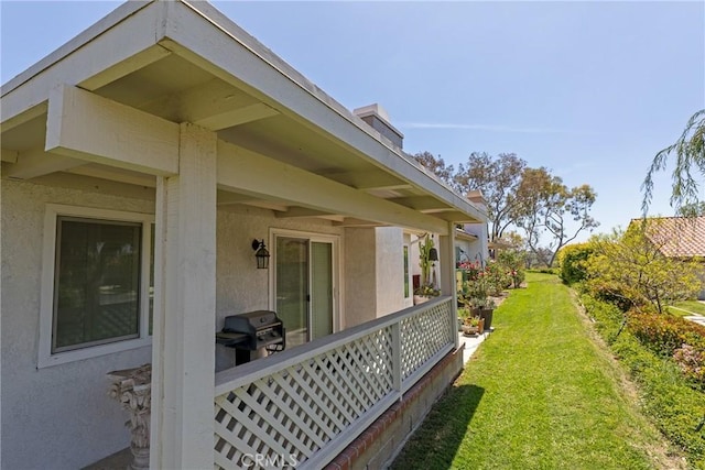 view of home's exterior featuring a yard and stucco siding