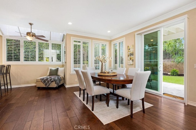 dining room featuring baseboards, ceiling fan, and dark wood finished floors