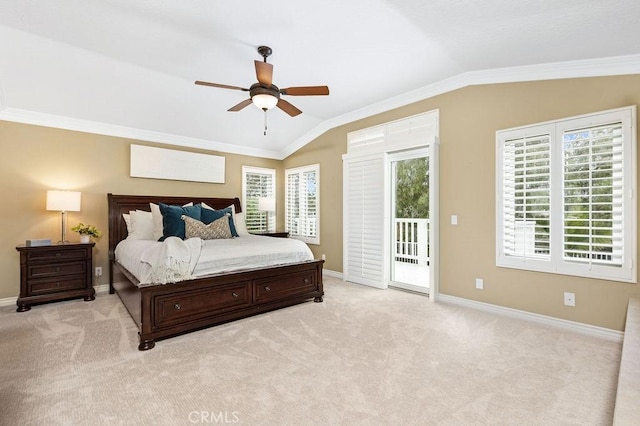 bedroom featuring baseboards, ornamental molding, vaulted ceiling, and access to exterior