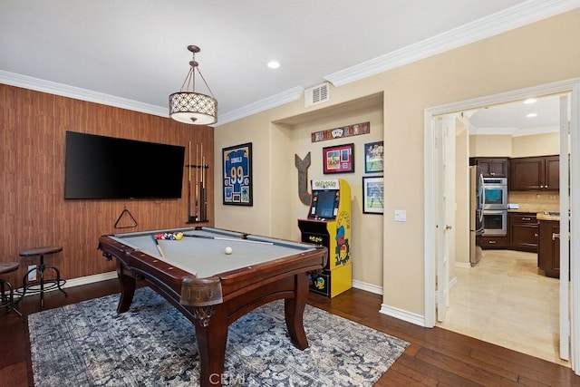 recreation room featuring visible vents, pool table, wood finished floors, baseboards, and ornamental molding