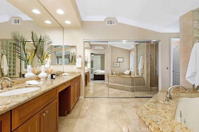 bathroom featuring crown molding, visible vents, and a sink