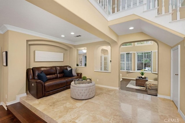 living area featuring baseboards, recessed lighting, visible vents, and ornamental molding