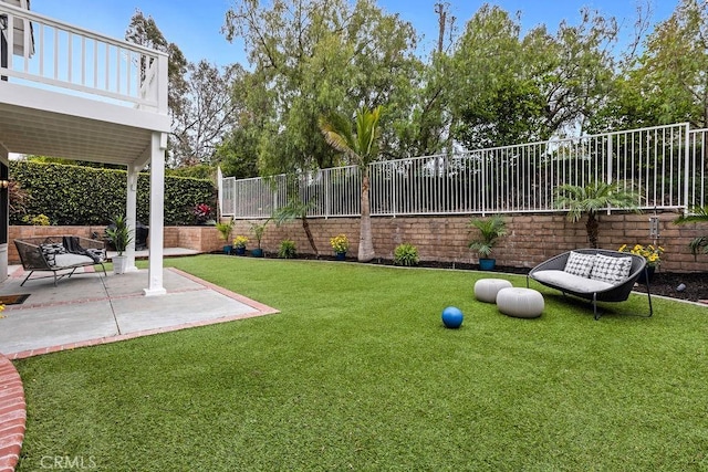 view of yard with a fenced backyard and a patio area