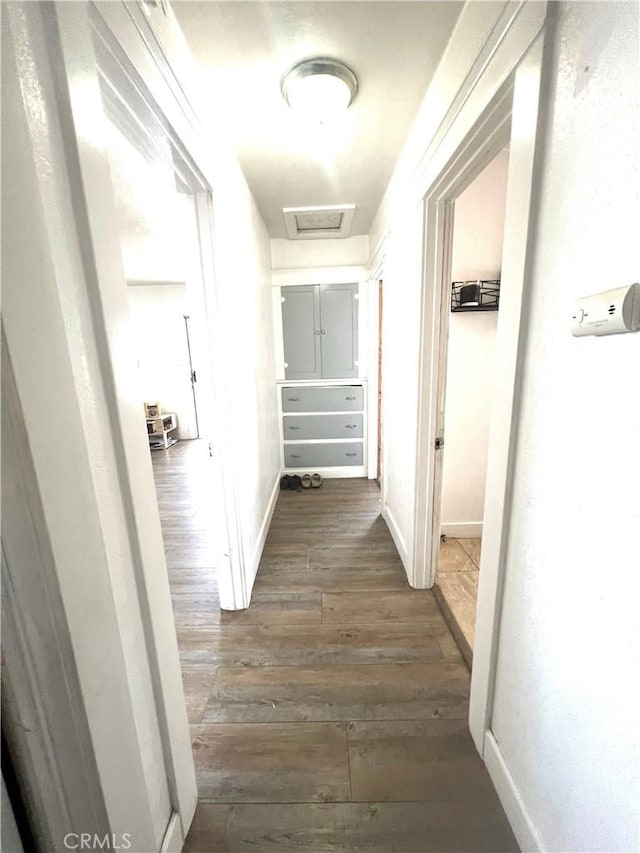 583 W G St, Colton, CA 92324 - hallway with baseboards, attic access, and dark wood-type flooring