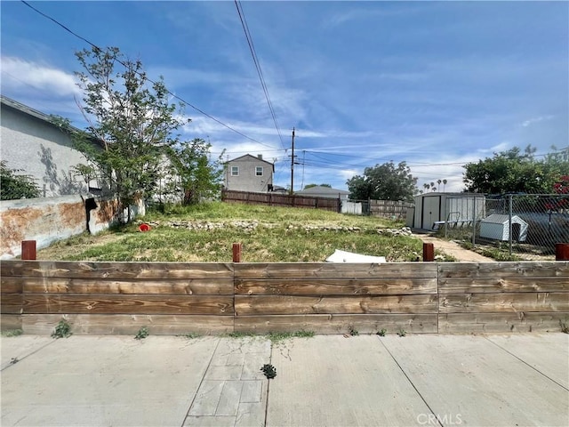583 W G St, Colton, CA 92324 - view of yard featuring an outbuilding, fence, and a storage shed