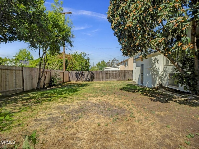 view of yard featuring a fenced backyard