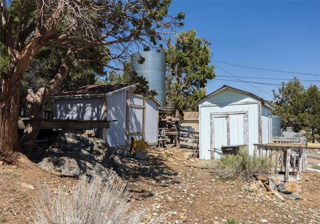 garage featuring a storage shed