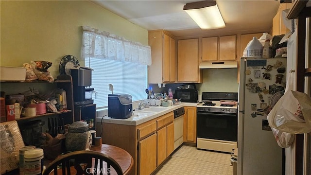 kitchen featuring a sink, under cabinet range hood, tile countertops, light floors, and white appliances