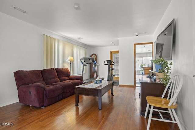 1213 Doris Ave, Oxnard, CA 93030 - living room featuring plenty of natural light, wood finished floors, and baseboards