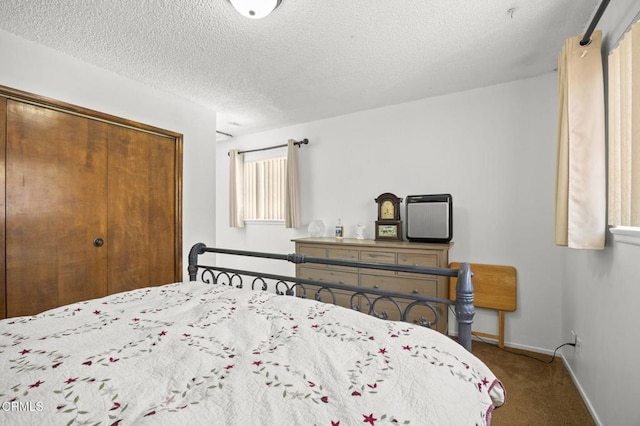 1213 Doris Ave, Oxnard, CA 93030 - carpeted bedroom featuring a closet, a textured ceiling, and baseboards