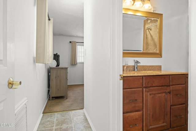 1213 Doris Ave, Oxnard, CA 93030 - bathroom with baseboards, vanity, a shower, and a textured ceiling