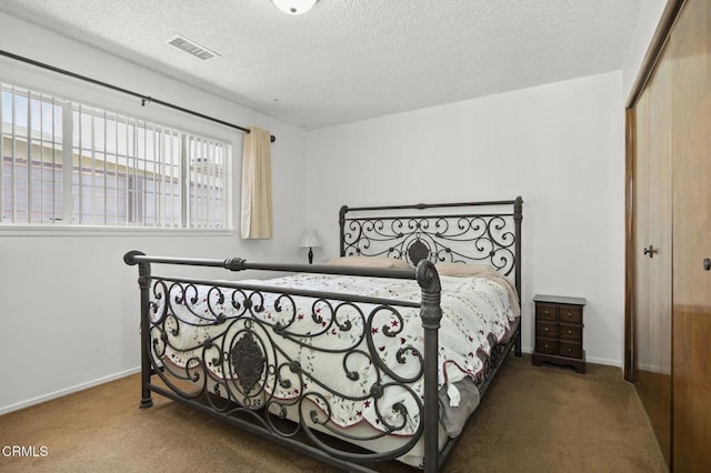 1213 Doris Ave, Oxnard, CA 93030 - bedroom featuring carpet, a closet, a textured ceiling, and baseboards