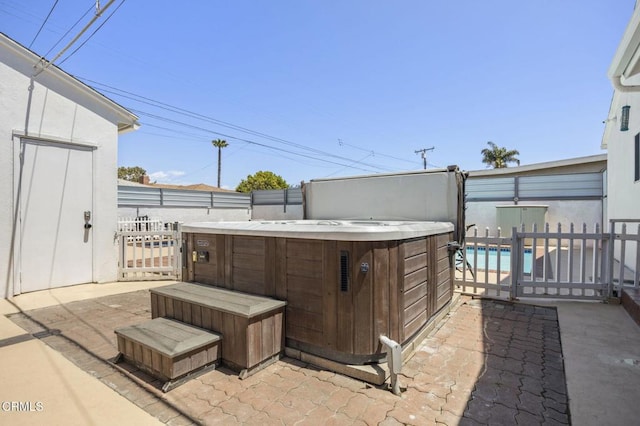 1213 Doris Ave, Oxnard, CA 93030 - view of patio / terrace with a hot tub and a fenced backyard