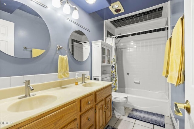 1213 Doris Ave, Oxnard, CA 93030 - full bath featuring tile patterned flooring, shower / bath combo, toilet, and double vanity
