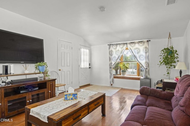 1213 Doris Ave, Oxnard, CA 93030 - living room with lofted ceiling, wood finished floors, and baseboards