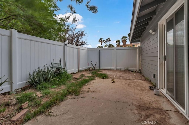view of yard featuring a patio area and a fenced backyard