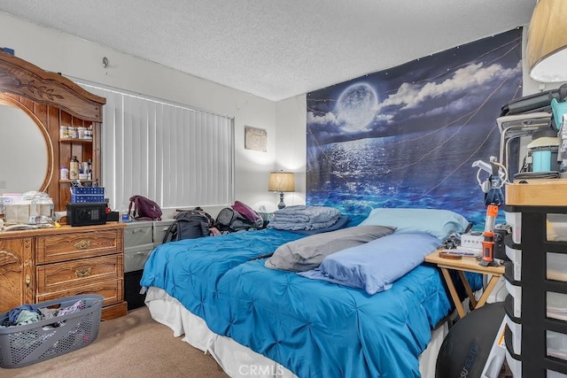bedroom featuring a textured ceiling and carpet floors
