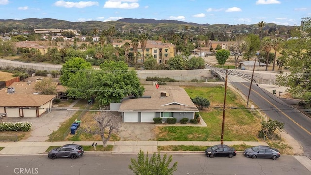 birds eye view of property featuring a mountain view