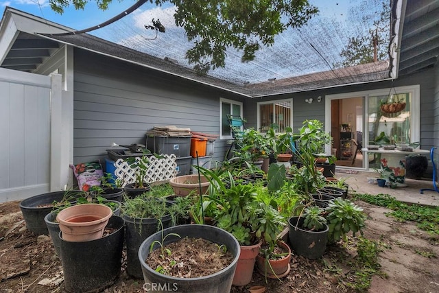 rear view of house with fence