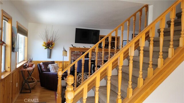 32991 Canyon Dr, Green Valley Lake, CA 92341 - staircase with wood finished floors and a wainscoted wall