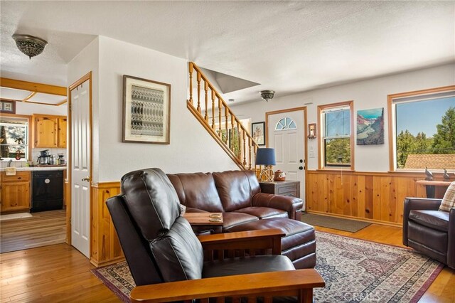 32991 Canyon Dr, Green Valley Lake, CA 92341 - living room with wainscoting, light wood-style floors, and stairway