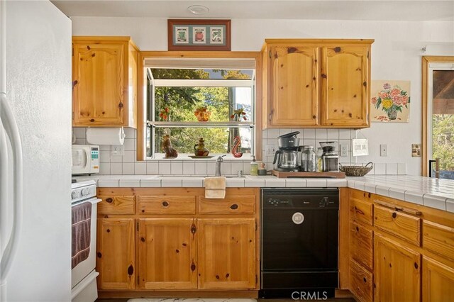 32991 Canyon Dr, Green Valley Lake, CA 92341 - kitchen with tasteful backsplash, white appliances, and a sink