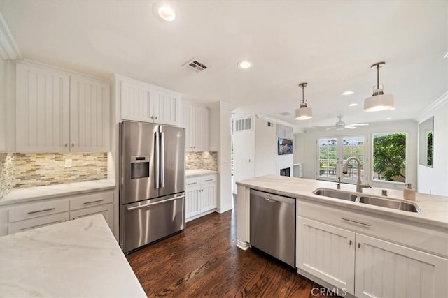1616 Cormorant Dr, Carlsbad, CA 92011 - kitchen featuring stainless steel appliances, a sink, crown molding, dark wood finished floors, and a ceiling fan