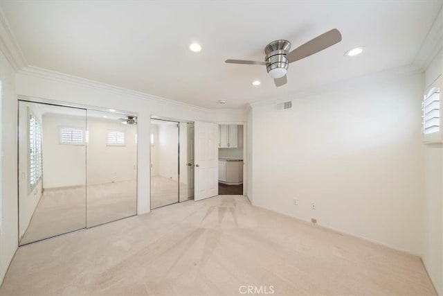 1616 Cormorant Dr, Carlsbad, CA 92011 - unfurnished bedroom featuring light carpet, multiple windows, ornamental molding, two closets, and recessed lighting