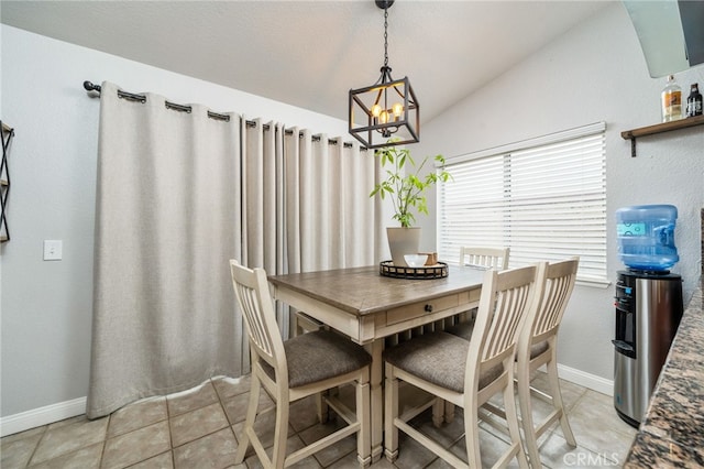 6932 Sundown Dr, Jurupa Valley, CA 92509 - dining room with baseboards, a notable chandelier, light tile patterned flooring, and lofted ceiling