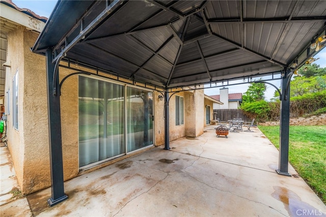 6932 Sundown Dr, Jurupa Valley, CA 92509 - view of patio featuring fence, a gazebo, and an outdoor fire pit